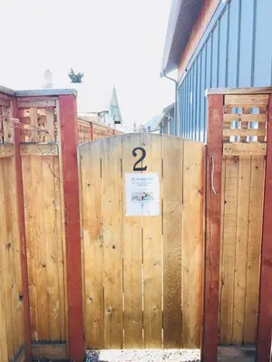 two wooden gates with the number two on them at Getaway Carriage House - Great Location! Private! in Penticton