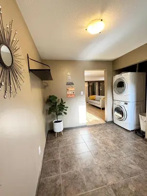 a living room with a washer and a washing machine at Peaceful House with Backyard in Langley