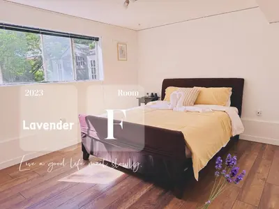 a bedroom with a bed and a window at Lavender house in Richmond