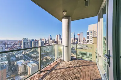 a balcony with a view of the city at City View 2 King Suites Floor-to-Ceiling Views in Calgary