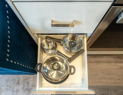 a wooden box with three frying pans in it at Vibrant PopArt downtown suite, comfy and stylish! in Calgary