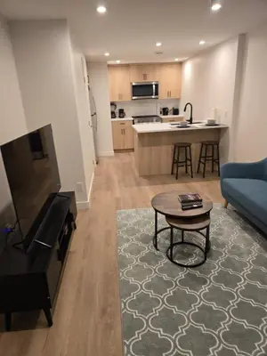a living room with a couch and a table at IELS Homes in Edmonton
