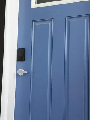 a blue door with a handle on a building at IELS Homes in Edmonton
