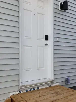 a white door on the side of a house at IELS Homes in Edmonton