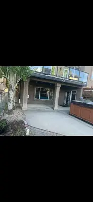 a large building with a tree in front of it at Rooms for Hosting in Calgary