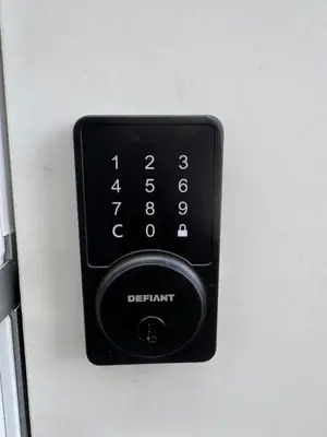 a black elevator button with the letters dart on it at Cozy Inn new basemt wt sep entrance contains 1 bdrm and den for up to 4 guests in Airdrie