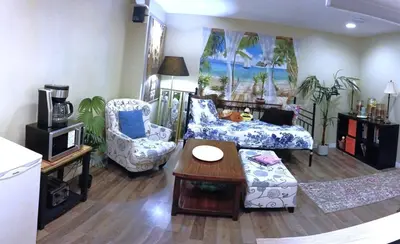 a living room with a couch and chairs and a table at Private & Beautifully Finished Suite, Windermere in Edmonton