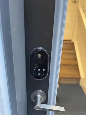 a door with a door knob and a staircase at Westminister Manor in Calgary