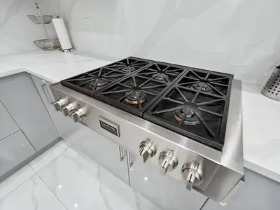a stove top oven in a white kitchen at Spacious 4BR Langley Home in Langley