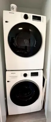 a white washer and dryer in a room at Perfect Vancouver Travel Hub for Couples or Family in Vancouver