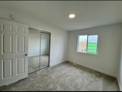 an empty room with a door and a window at ED Phonix
