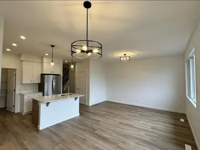 an empty kitchen and living room of a house at ED Phonix