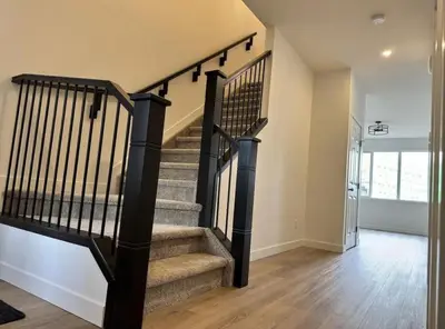 a staircase with black railings in a house at ED Phonix