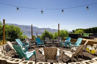 a group of chairs sitting on a patio at Magical Lake View in Peachland