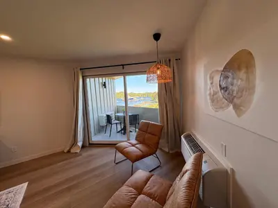 a living room with a couch and a chair at Hotel 19 in Port Hardy