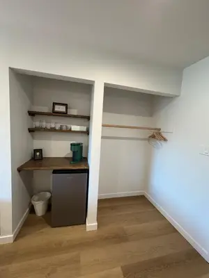a kitchen with a desk in a room at Hotel 19 in Port Hardy