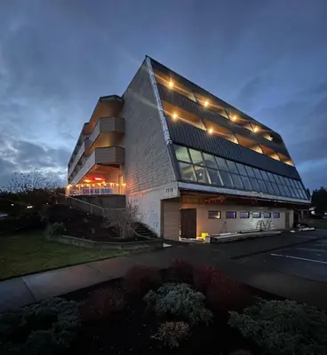 a large building with lights on top of it at Hotel 19 in Port Hardy