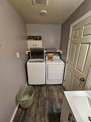 a small laundry room with a washer and dryer at Cozy Bungalow