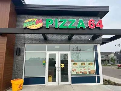 a pizza sign on the front of a restaurant at 1-BR Suite with Private entrance near Restaurants, Shops, Local Amenities in Edmonton