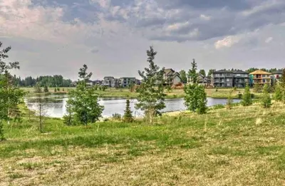 a view of a river with houses in the background at 1-BR Suite with Private entrance near Restaurants, Shops, Local Amenities in Edmonton