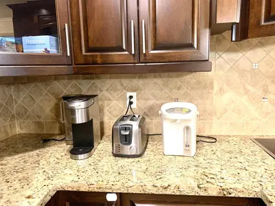 a kitchen counter with a coffee maker and a toaster at Sakura Stay two bedrooms with a private bathroom in Richmond
