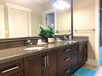 a bathroom with two sinks and a large mirror at Sakura Stay two bedrooms with a private bathroom in Richmond