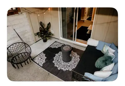 a living room with a couch and a table at Lower suite in family friendly townhome in Victoria