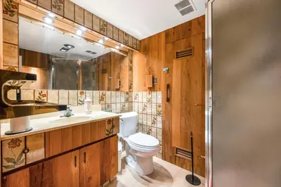 a bathroom with a toilet and a sink and a shower at Picturesque room surrounded by flowers with share spaces in Vancouver