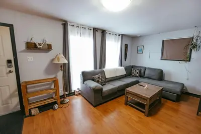 a living room with a couch and a table at Pet-Friendly Invermere Home with Firepit by StayIn in Lake Windermere