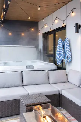 a living room with a couch and a bath tub at Huckin' Harry's in Revelstoke
