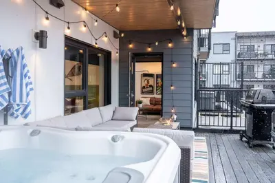 a bath tub sitting on top of a building at Huckin' Harry's in Revelstoke