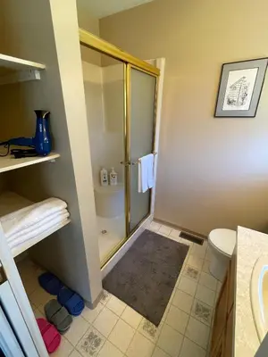 a bathroom with a shower and a toilet at Guest Suite in Maple Ridge in Maple Ridge District Municipality