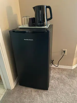a black refrigerator with a coffee pot on top of it at Guest Suite in Maple Ridge in Maple Ridge District Municipality