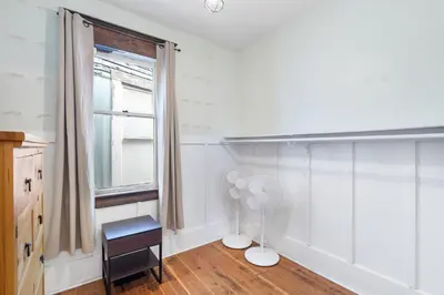 a room with a fan and a window at Adorable Kits Home with Balcony and Garden Retreat in Vancouver