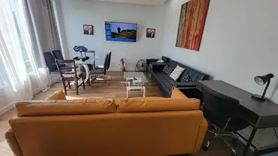 a living room with a couch and a table at 4-Bedroom Home by Downtown and Airport in Calgary