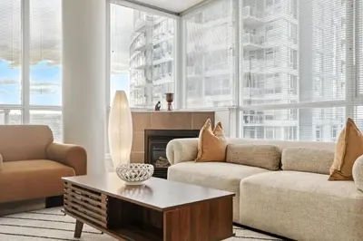 a living room with a couch and a coffee table at 17th Avenue Paranomas Escape in Calgary