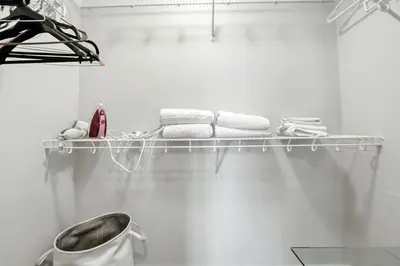 a towel rack in a bathroom with towels at 17th Avenue Paranomas Escape in Calgary