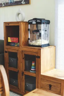 a wooden cabinet with a coffee maker in it at Sylvan Cabin - 3 BR Family Fun Luxurious Yard in Sylvan Lake
