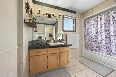 a bathroom with a sink and a shower at Calgary - By Mountains and Ski in Calgary