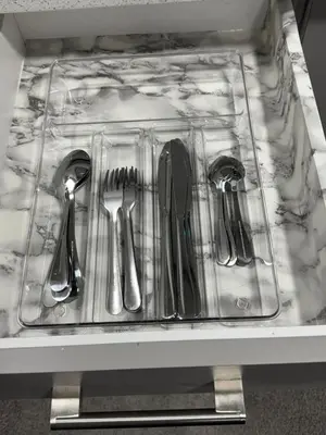 a plastic tray with utensils sitting on a counter at The Nesting Cove in Airdrie