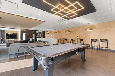 a billiard room with a pool table in it at Central Kelowna TOP FLOOR rooftop patio in Kelowna