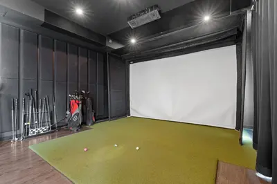 a hockey room with avertisement for avertisementosateosateosateosateosateosateosate at Central Kelowna TOP FLOOR rooftop patio in Kelowna