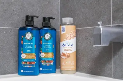 three bottles of disinfectants sitting on a bathroom sink at Boutique-Style Studio Unit in Edmonton