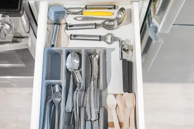 a drawer filled with utensils in a kitchen at Boutique-Style Studio Unit in Edmonton