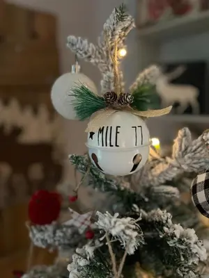 a christmas ornament on a christmas tree at Charming Lakefront 100yr old Railway Cottage in Youbou