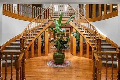 a staircase with a potted plant on the floor at Freele Escape Secluded Nature Haven Sleeps 17 in Priddis