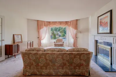 a living room with a couch and a fireplace at The Coastal Garden Retreat in Delta