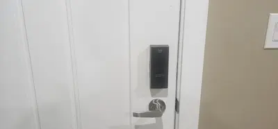 a door with a speaker on the side of it at Cozy and Affordable Apartment - Guesthouse South West Airdrie in Airdrie