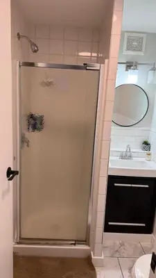 a bathroom with a shower and a sink at Supinder's Rentals in Golden