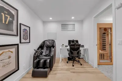 an office with two black chairs and a desk at 1P Culture - Sara in Calgary